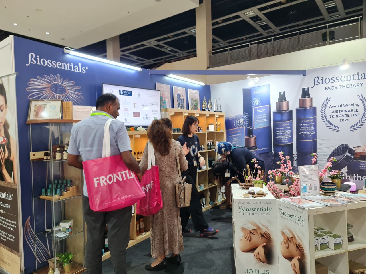 Visitors exploring Biossentials spa and skincare products at the brand’s exhibition stand