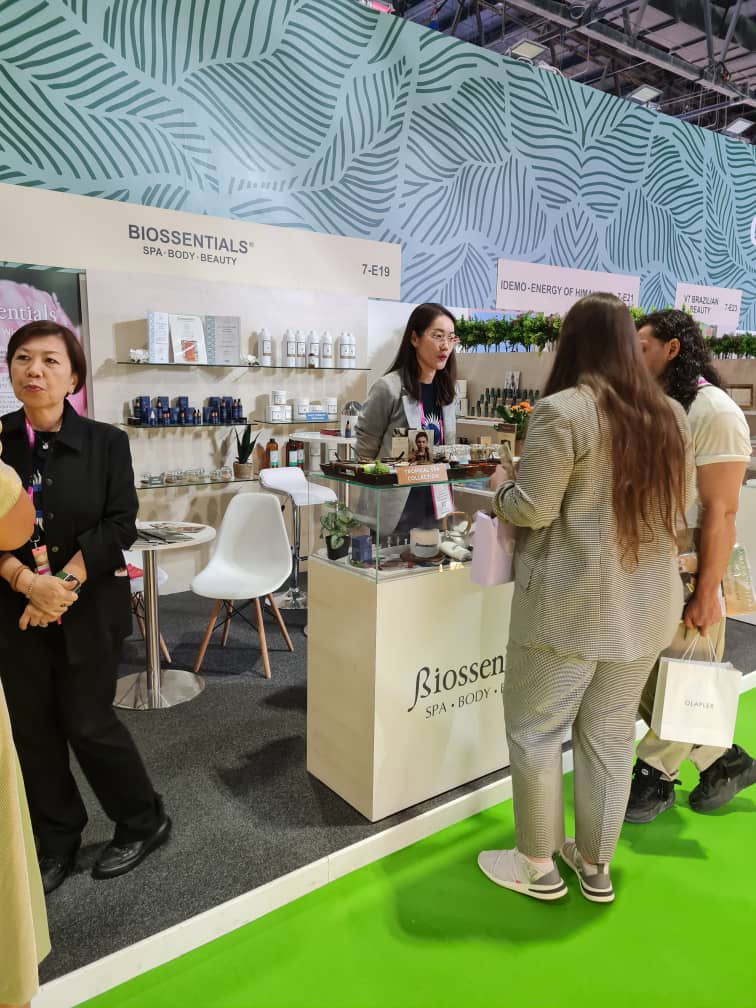 Visitors exploring Biossentials spa and beauty products at Beautyworld Middle East 2024 in Dubai