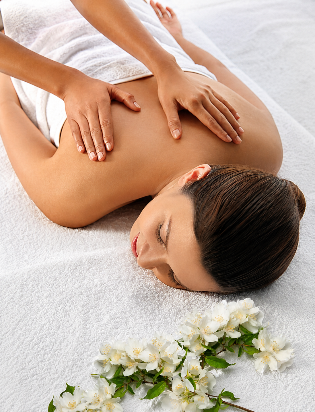 Spa therapist performing a relaxing Biossentials back and shoulder massage
